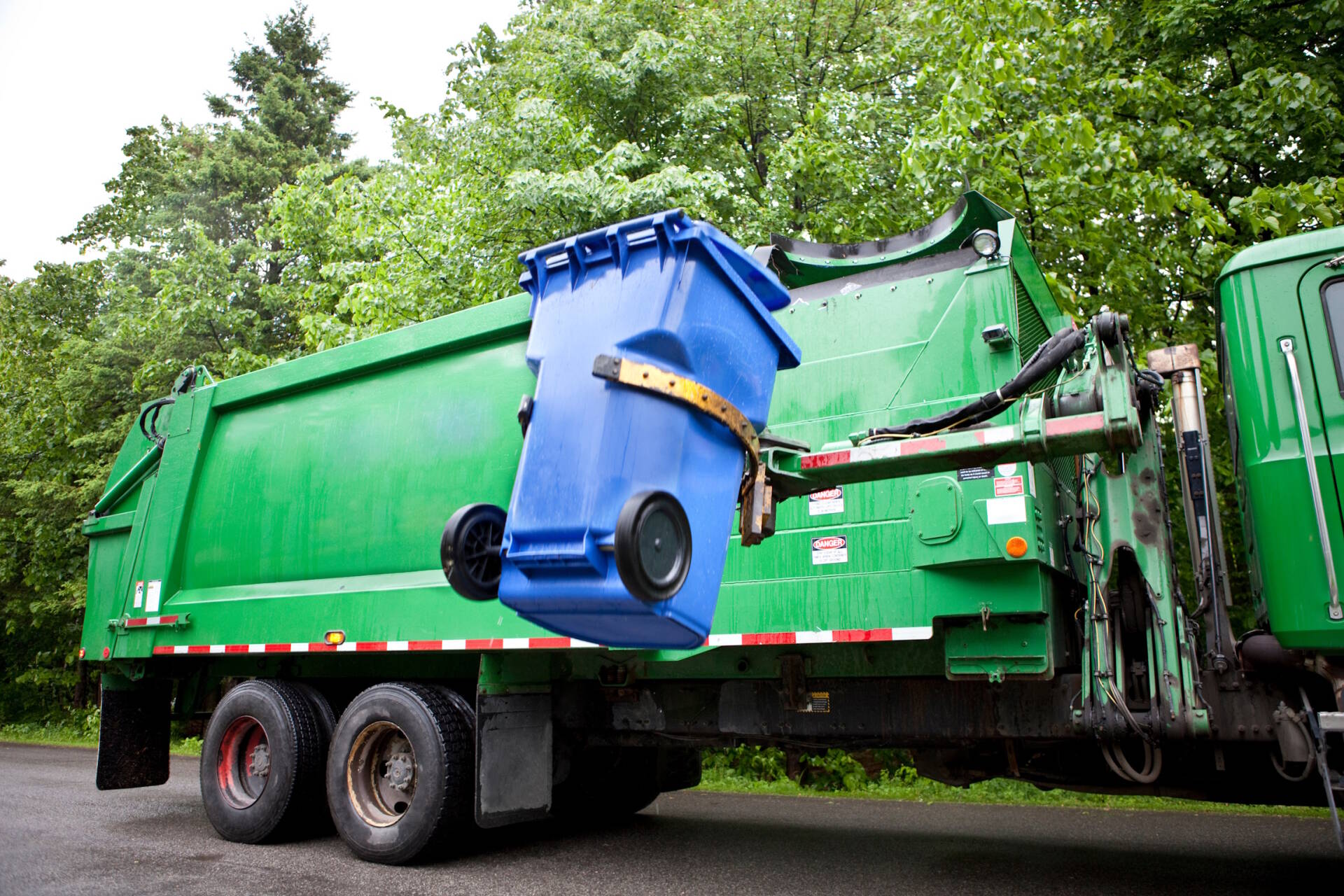 Recycling truck picking up bin